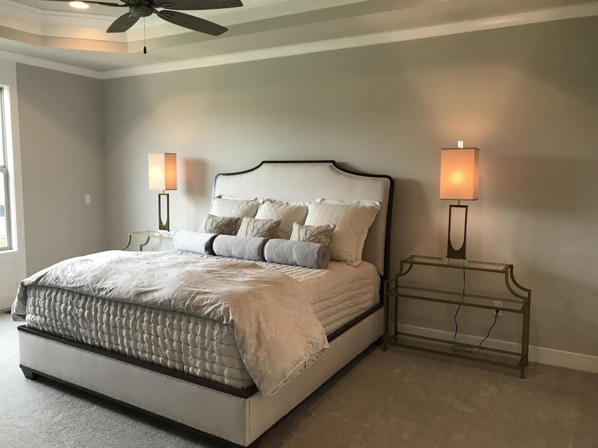 Large bedroom with king bed in a norway model from Lambie custom Homes
