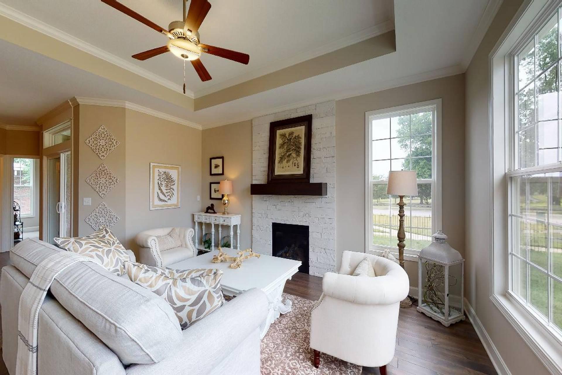 Living room with fireplace in a Todd model from Lambie custom homes
