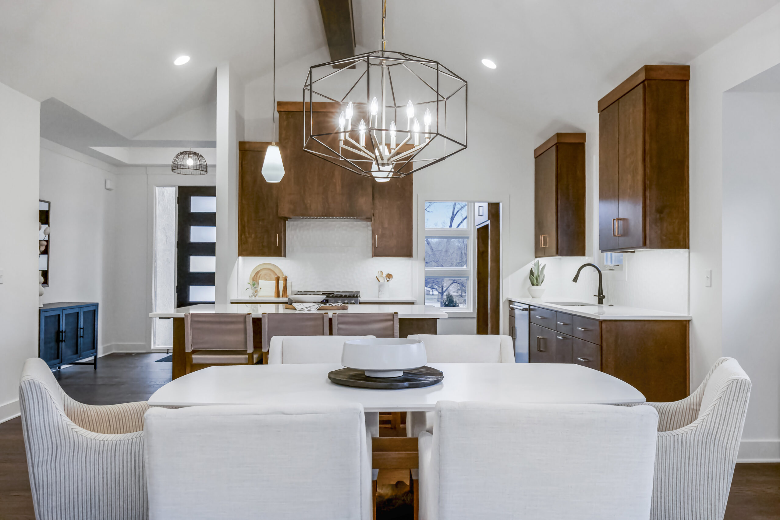 kitchen with brown cabinets and center island in the holly model from lambie homes