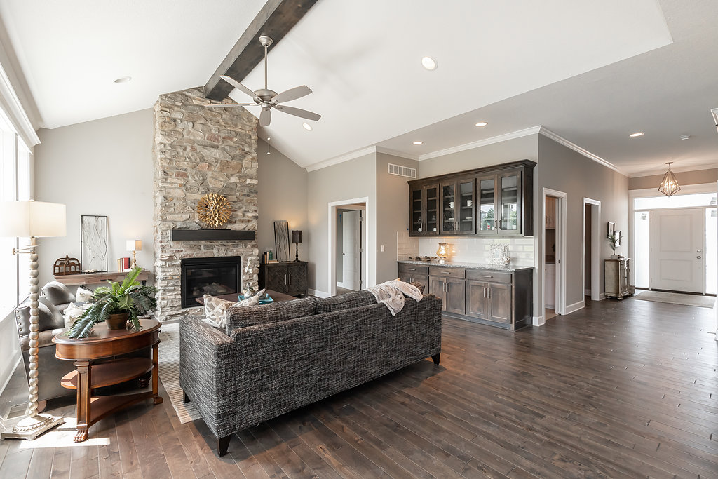 Living room with stone fireplace in the hawthorn model from lambie homes