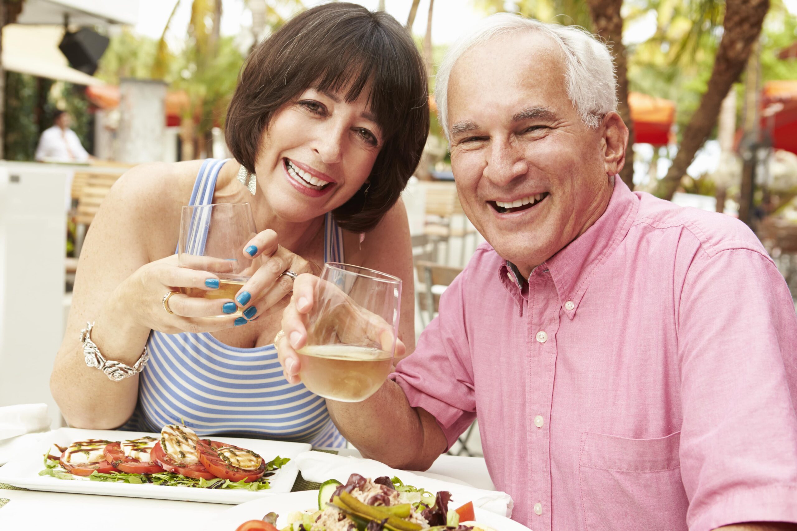 older couple enjoying an outdoor lunch